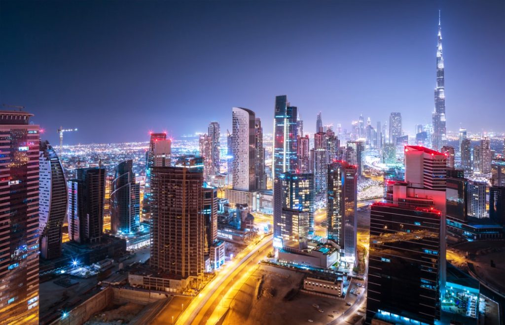 Beautiful night city, cityscape of Dubai, United Arab Emirates, modern futuristic architecture nighttime illumination, luxury traveling concept